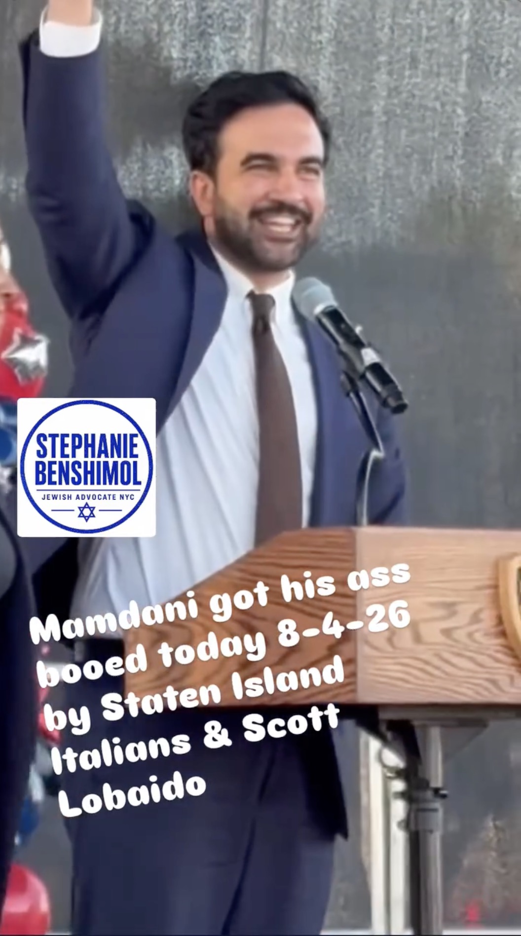 Mayor Zohran Mamdani smiling at the podium during the Staten Island National Night Out event